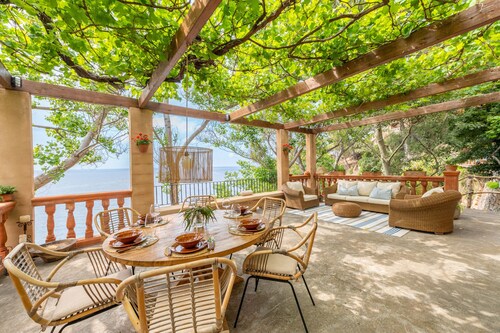Paradise seafront villa in the idyllic Deia coast.