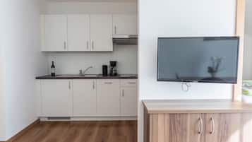 Fridge, stovetop, dishwasher, coffee/tea maker