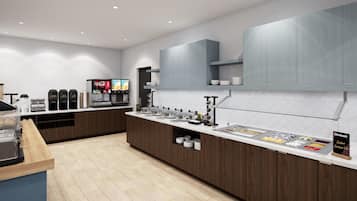 A modern kitchen area with a coffee station, beverage dispensers, and a buffet counter.