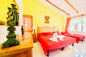 A hotel room with a large bed, two smaller beds, a wooden nightstand, a green decorative item, a framed picture on the wall, and a window with curtains. - Room-executive Budget Room With Swimming (Playa del Carmen)