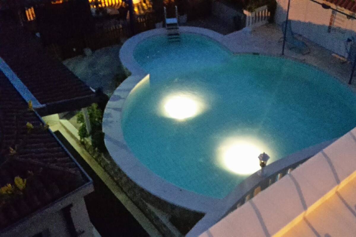 A swimming pool with two lights at the bottom.