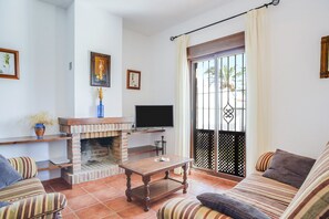 TV, fireplace - Charming Villanueva 3 House with Private Pool, Terrace, Garden & Wi-Fi (Conil de la Frontera)