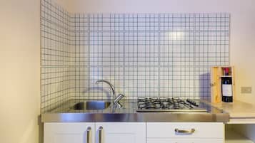 Fridge, stovetop, dishwasher, coffee/tea maker