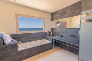 Bathtub, hair dryer, towels