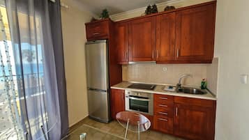 Apartment, 1 Bedroom, Smoking, Balcony | Private kitchen | Fridge, electric kettle, highchair