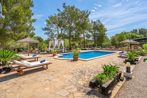 A pool area with lounge chairs, a gazebo, and potted plants. - Fantastic Finca Son Mulet with Pool, Aircondition, Garden, Terrace & WLAN; Parking Available (Llubí)