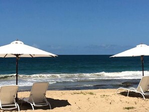 On the beach, sun loungers, beach towels