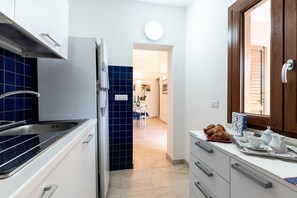 Kylskåp, ugn, spishäll och diskmaskin