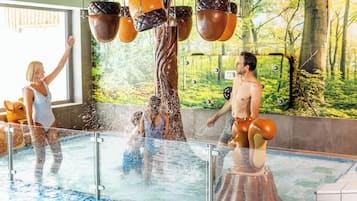 Indoor pool, pool umbrellas, pool loungers