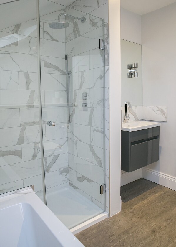 Bathtub, hair dryer, towels, soap