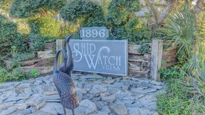 A sign for Ship Watch Villas with a date '1896' and a bird sculpture. - Oceanfront Condo with amazing views of The Atlantic (North Topsail Beach)