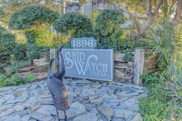 A sign for Ship Watch Villas with a date '1896' and a bird sculpture. - Oceanfront Condo with amazing views of The Atlantic (North Topsail Beach)