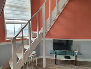 Condo, 1 Double Bed (Water Lily) | Living area | 60-inch flat-screen TV with cable channels, TV, heated floors - Sunset Cantata (Incheon)