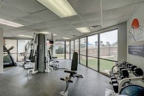 A gym with exercise equipment, a bench, and a rack of dumbbells. - Top Floor, eagle eye views of The Atlantic! Tons of amenities (North Topsail Beach)