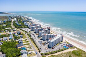 A coastal residential area with beachfront properties and a road leading to the beach. - Top Floor, eagle eye views of The Atlantic! Tons of amenities (North Topsail Beach)