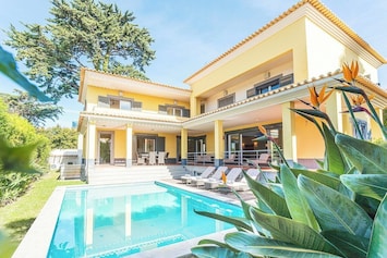 Luxury villa with pool and garden.