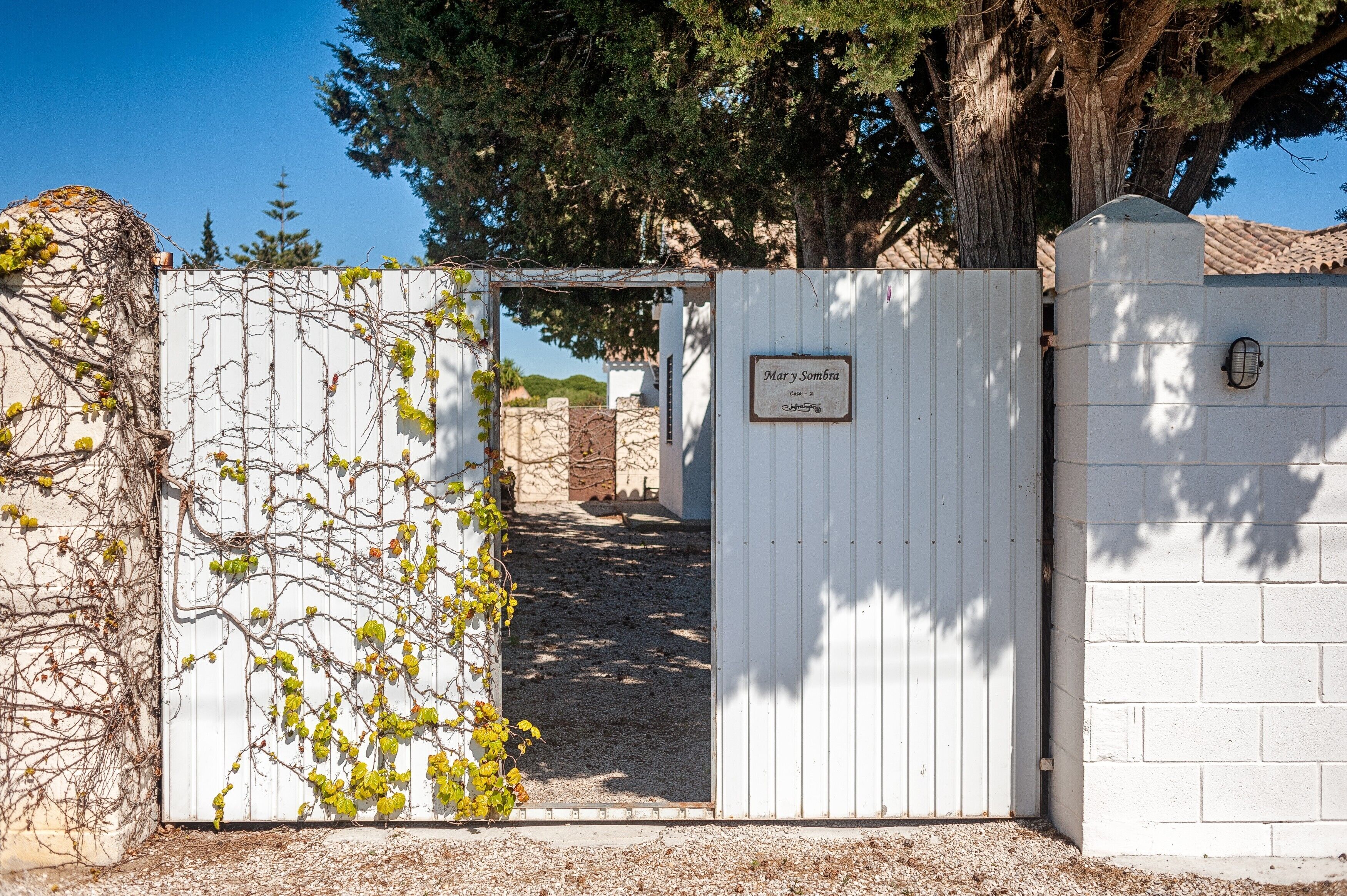 A gated entrance with a sign reading 'Mary & Sombra.'