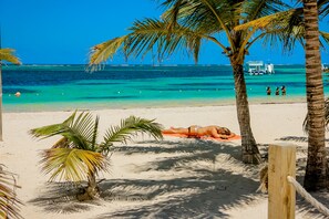 On the beach, white sand, beach towels - White Sands Beach (Punta Cana)