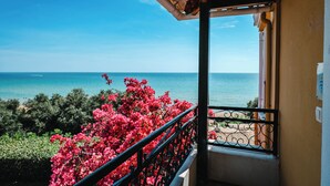 A balcony with a view of the sea, a railing, and a building facade. - Corfu Glyfada Menigos Resort 46 (Corfu)