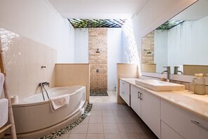 Separate bathtub and shower, rainfall showerhead, hair dryer, towels