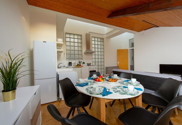 Standard Apartment, 1 Bedroom (Mansarda Gargantini) | Private kitchen | Full-size fridge, oven, stovetop, dishwasher