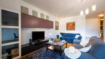 Family Apartment, Multiple Bedrooms (Santiago Home) | Living area | 22-inch flat-screen TV with digital channels, TV, DVD player