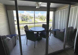 Relax on the balcony with a round table and comfortable seating for four.