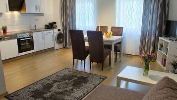 Apartment, Garden View | Private kitchen | Fridge, oven, stovetop, coffee/tea maker
