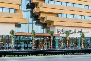 A modern building with a sign reading "Park Inn".