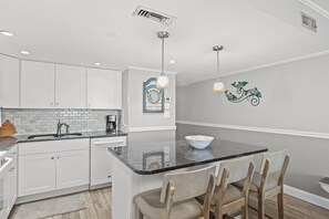 Fridge, microwave, oven, stovetop - Garden City Beach Oceanfront Condo 1102 | Rising Tides Properties Rental (Murrells Inlet)