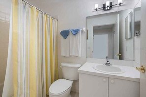Combined shower/bathtub, hair dryer, towels, toilet paper
