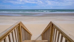 A wooden staircase leading to a beach with a view of the ocean. - Direct Oceanfront with 4 Bedrooms, amazing ocean views and beach access- Adjoining side available... (North Topsail Beach)
