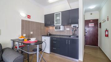 Fridge, microwave, stovetop, coffee/tea maker