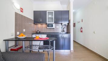 Fridge, microwave, stovetop, coffee/tea maker