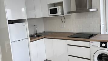 Fridge, microwave, stovetop, coffee/tea maker