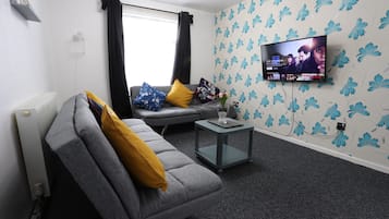 32-inch flat-screen TV with cable channels, TV
