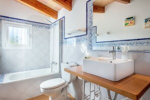 Bathtub, hair dryer, towels