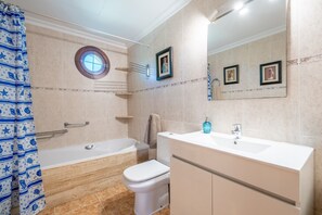 Bathtub, hair dryer, towels