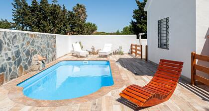 Air-conditioned Holiday Home with Patio, Pool, Wi-Fi and Lawn