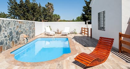 Air-conditioned Holiday Home with Patio, Pool, Wi-Fi and Lawn