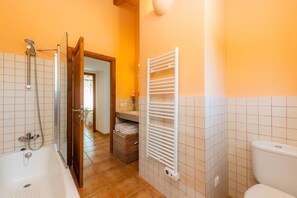 Bathtub, hair dryer, towels