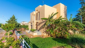A modern building with a flat roof, a central entrance, and a small staircase leading to the entrance. - Villa With Pool in Idyllic Location - Ca Na Xisca (Sa Coma)