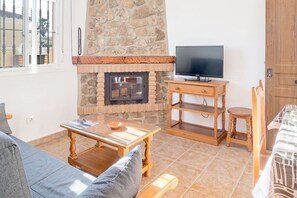 TV, fireplace - Air-Conditioned Apartment Close to the Beach with Pool, Terrace, Garden & Wi-Fi (Zahora)