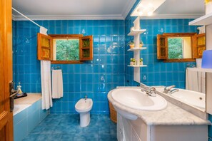 Bathtub, hair dryer, towels