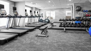 A gym with treadmills, elliptical machines, and a variety of weights and exercise balls. - Fairfield Inn & Suites by Marriott Rocky Mount (Rocky Mount)