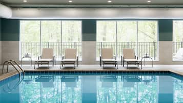 Indoor pool, open 10:00 AM to 10:00 PM, pool loungers