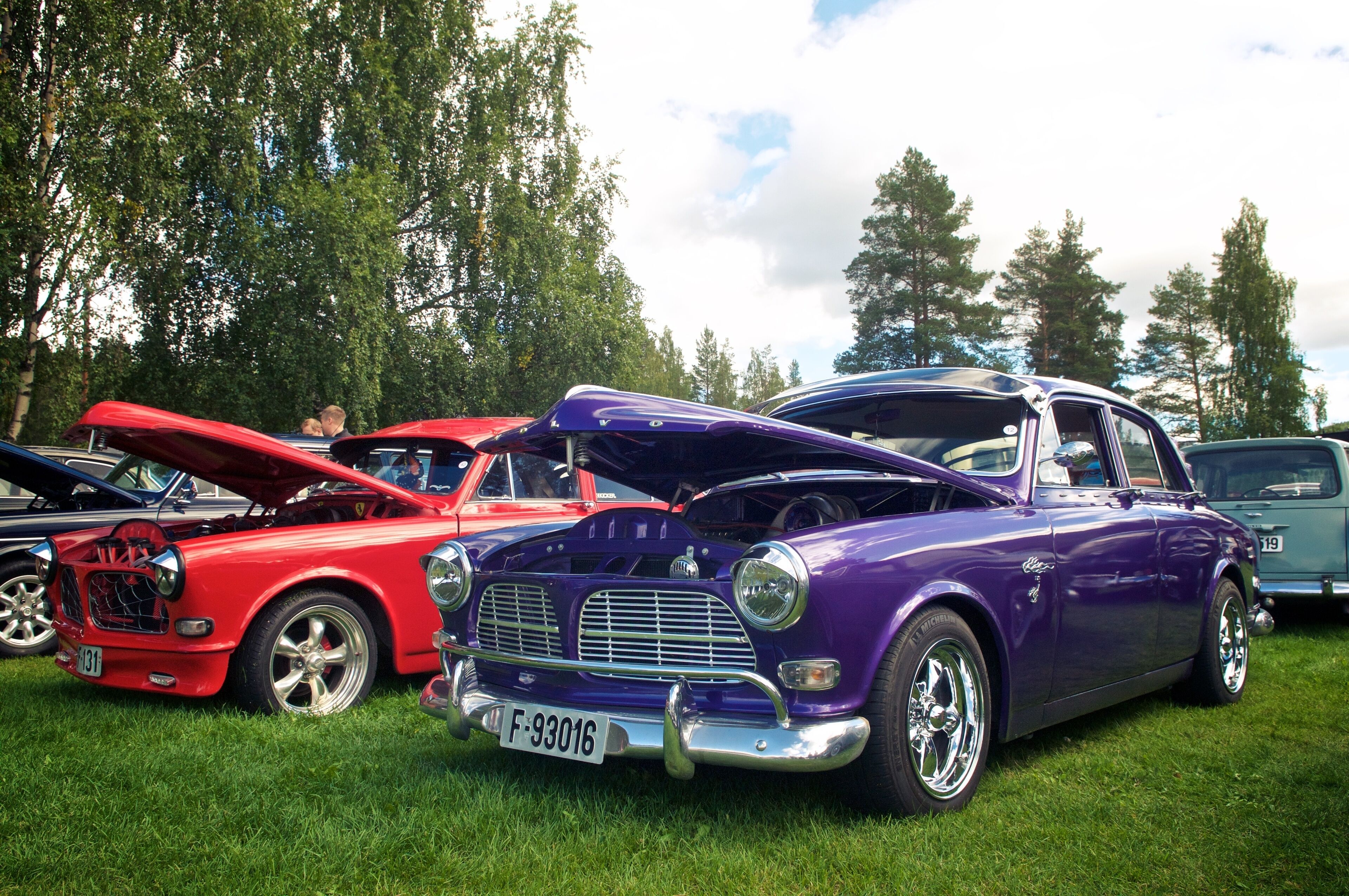 A classic car show with vintage cars on display.