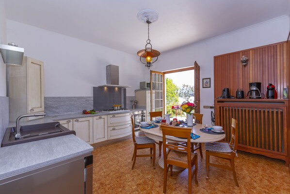 Family Villa, Multiple Bedrooms, 2 Bathrooms, Lakeside (Villa Martine Au Bord Du Lac) | Private kitchen | Full-sized fridge, microwave, oven, stovetop