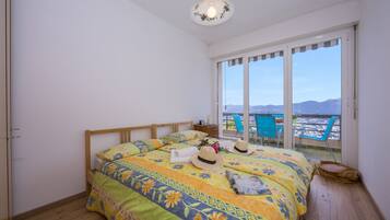 Family Apartment, Multiple Bedrooms, 2 Bathrooms, Mountainside (Aldesago Panoramica) | 2 bedrooms, WiFi, bed sheets