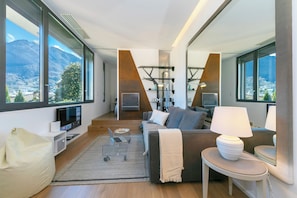 Family Apartment, 1 Bedroom, Air conditioning (Casa Basilico) | Living area | 24-inch flat-screen TV with satellite channels, TV - Casa Basilico (Lugano)